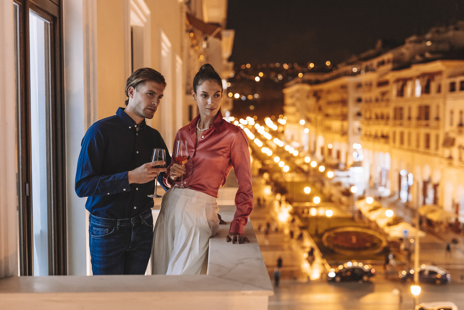 Couple on a balcony spending the perfect Valentine's day in Thessaloniki at Electra Hotels