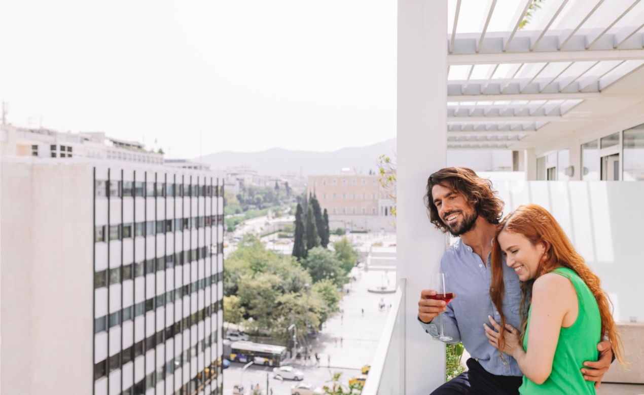 Electra_Hotel_Athens_Lifestyle_Couple_Balcony_-scaled-2